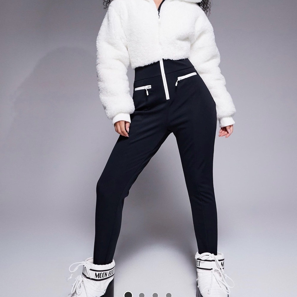 4505 Hourglass Ski suit with faux fur panels and skinny legs in black and white